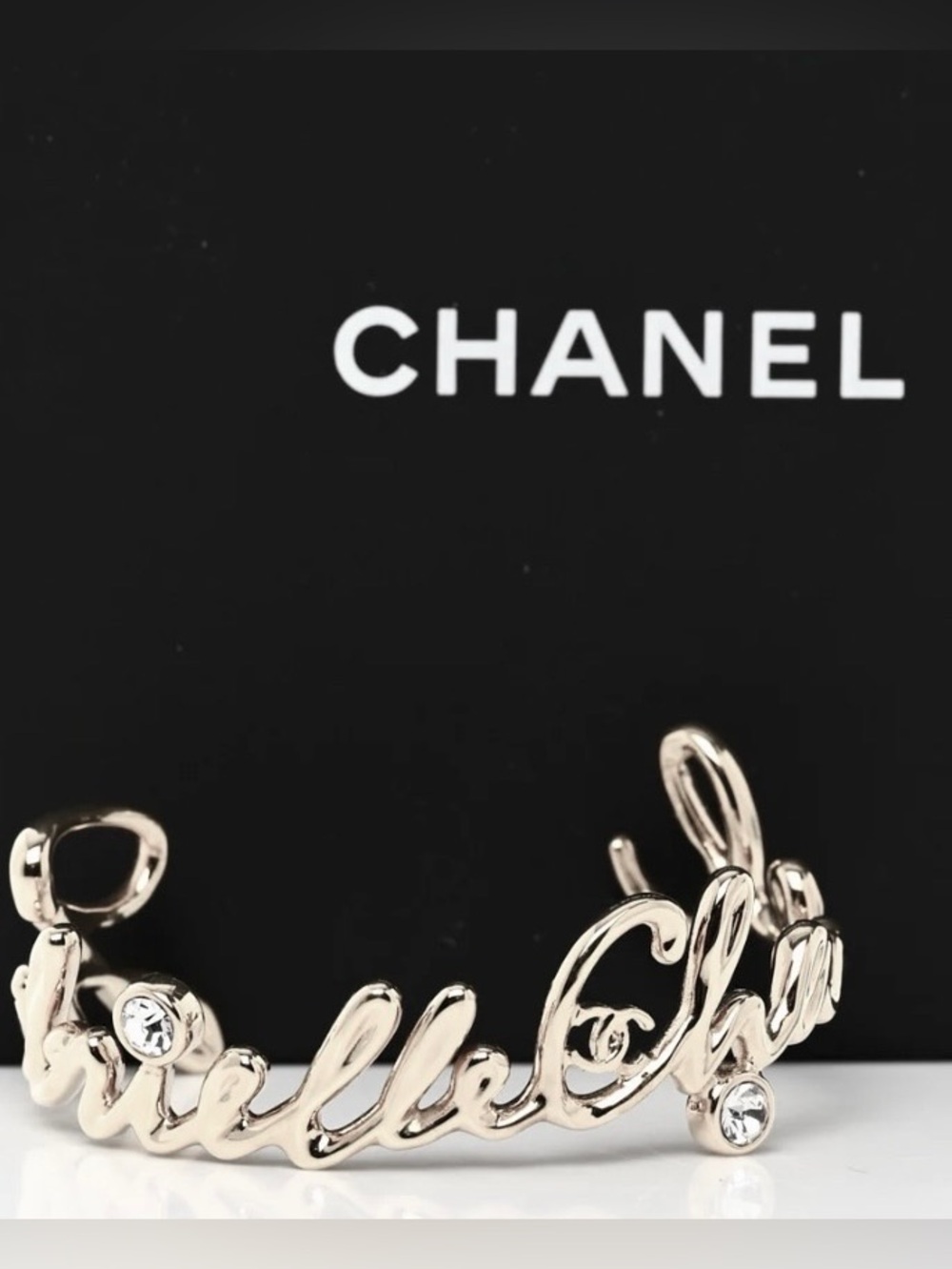 CHANEL silver metal Script Logo Cuff with Clear Crystals